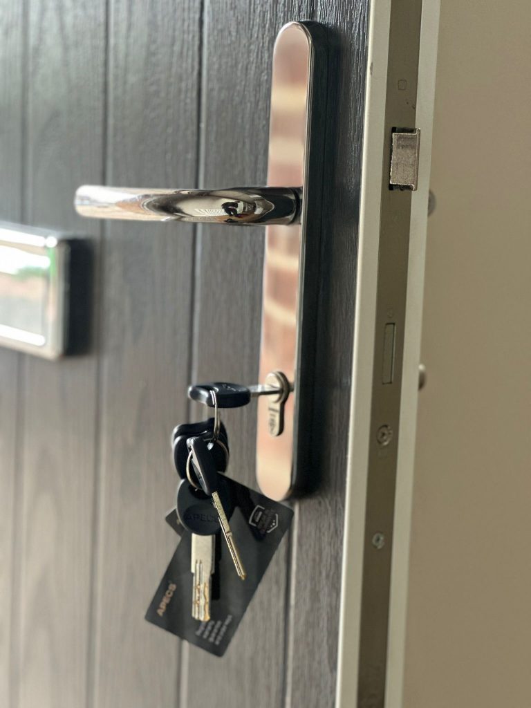 New cylinder with full set of keys on a dark composite door in Sutton-in-Ashfield