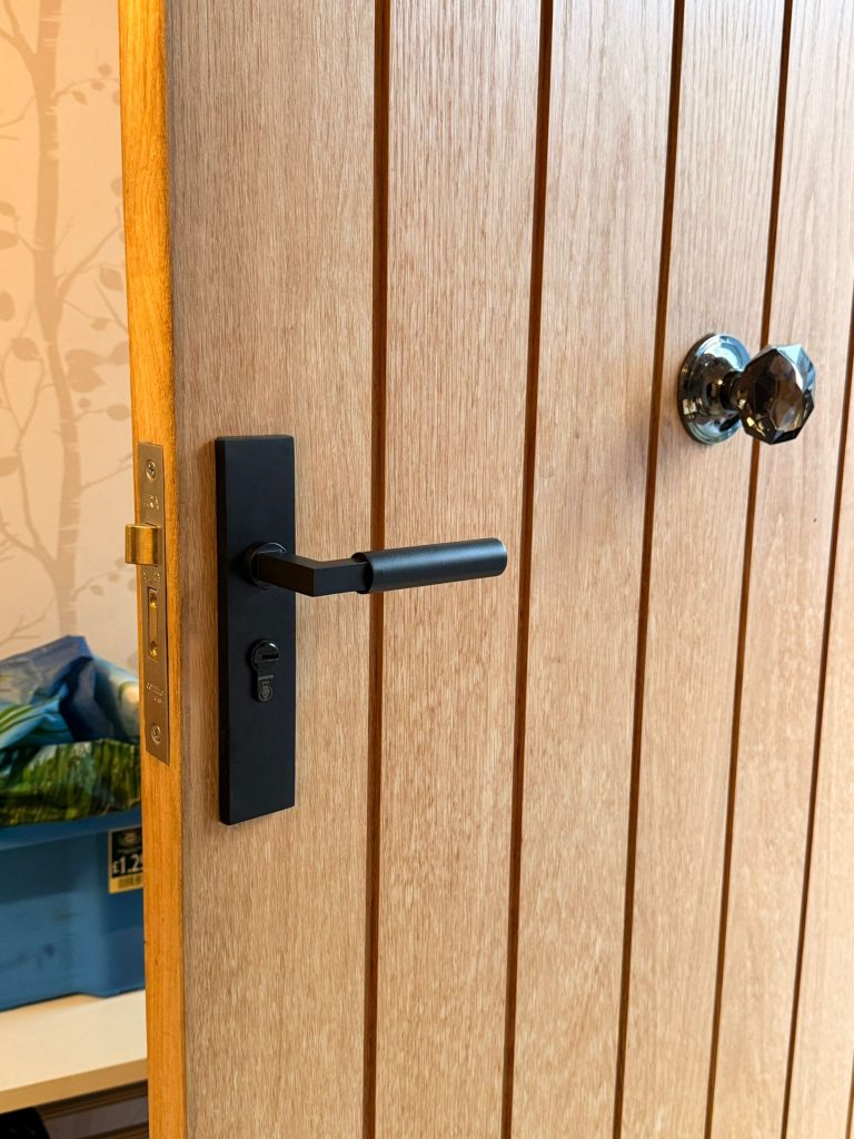 Matt black handle and euro cylinder on an oak cottage door in Heanor