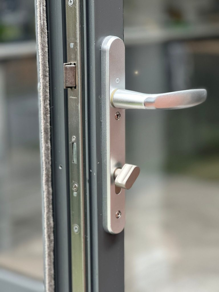 New cylinder and keys on a white uPVC back door in Ruddington
