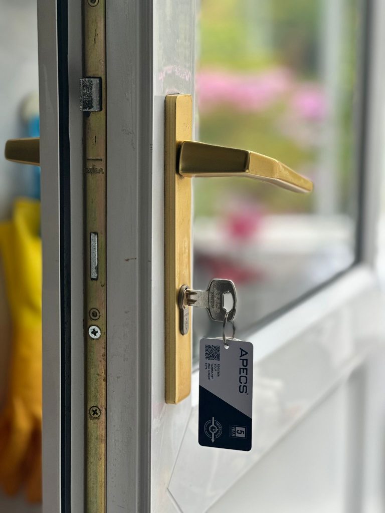 Gold handle and multipoint strip on a uPVC door in Cotgrave
