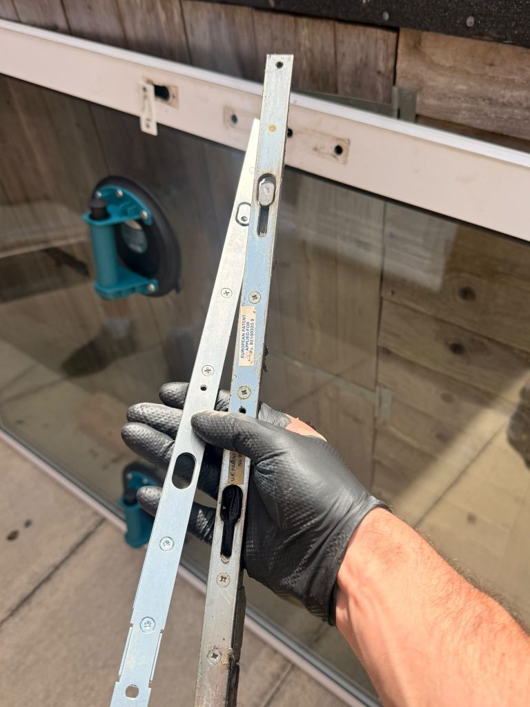 Old aluminium sliding patio door mechanism, rollers and track replaced by Max the Locksmith