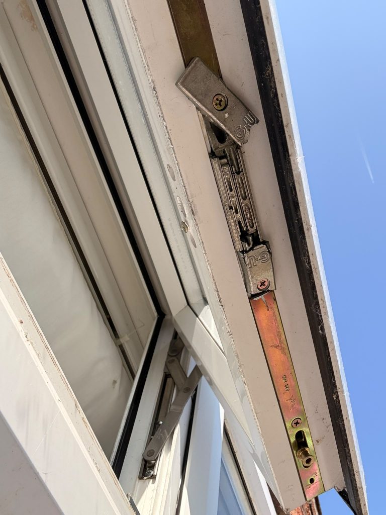 Espagnolette shootbolt gear on an open uPVC window in West Bridgford